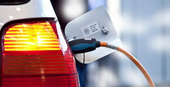 Electric car plugged into EV charger after professional installation in Baton Rouge, LA