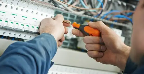electrical service showing licensed electrician performing electrical panel maintenance and adjustments in Baton Rouge, LA
