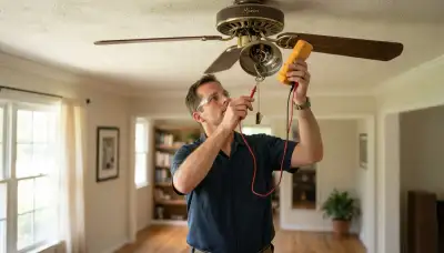 Electrician tests a Baton Rouge ceiling fan pull-chain switch with a multimeter for fault diagnosis