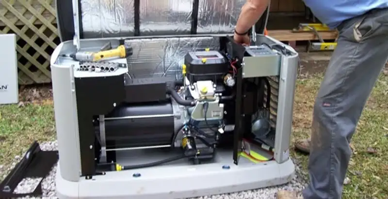 generator installation service showing technician connecting and configuring generator components in Baton Rouge, LA