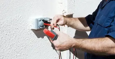 Electrician performing home electrical outlet and wiring inspection in Baton Rouge, LA