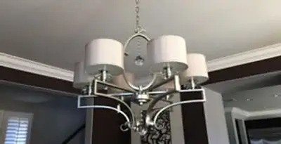 Modern chandelier installation with multiple light fixtures in Baton Rouge, LA