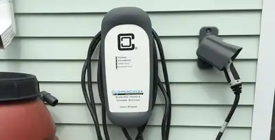 Outdoor electric vehicle charger installation on residential wall in Baton Rouge, LA
