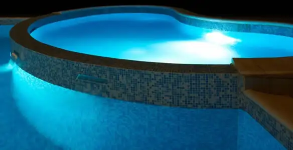pool light installation and repair services highlighting illuminated pool interior lighting in Baton Rouge, LA