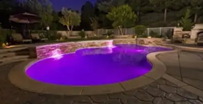 pool light installation and repair services illuminating a residential swimming pool in Baton Rouge, LA