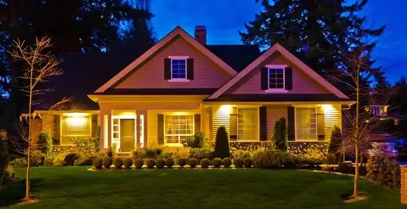 security light installation services illuminating a residential exterior at night in Baton Rouge, LA