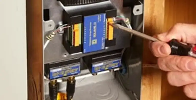 Whole home surge protection device being installed by a licensed electrician to protect electrical systems in Baton Rouge, LA